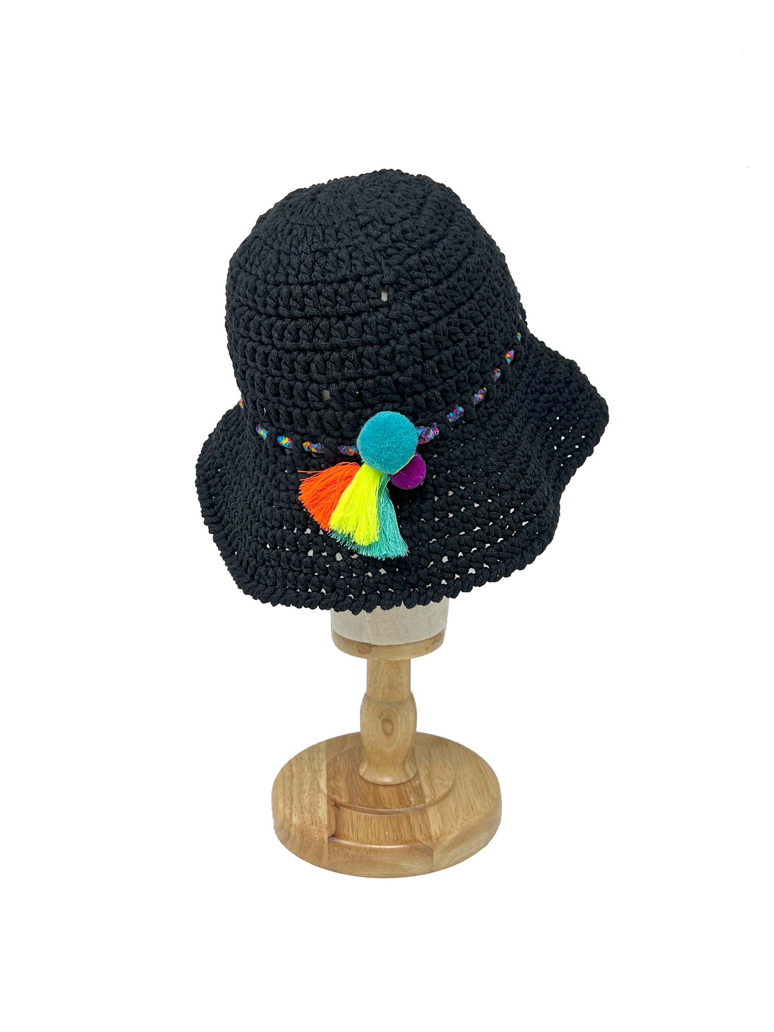 Black crocheted bucket hat with pom poms