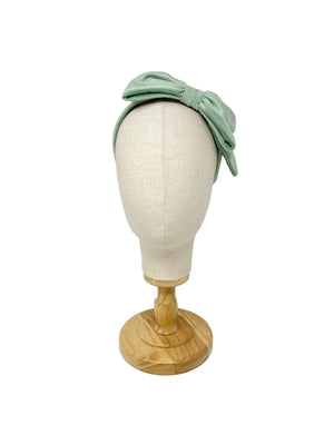 Cerchietto per capelli in velluto di cotone verde chiaro con fiocco laterale